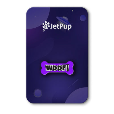 A colorful enamel pin with 'WOOF!' text on a bone-shaped backing, displayed on a purple background with the JetPup logo.