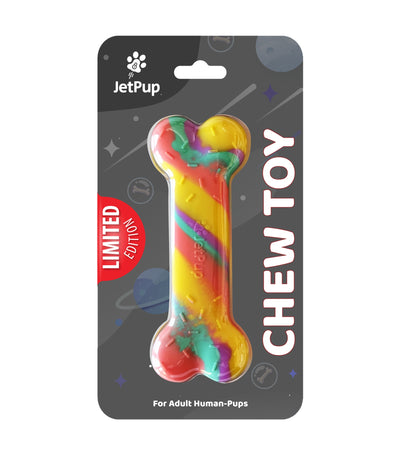 A rainbow-colored silicone bone-shaped chew toy for human puppies, packaged on a black card with 'LIMITED EDITION' text and the JetPup logo.