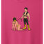 Closeup image of a human pup and handler on a pink background